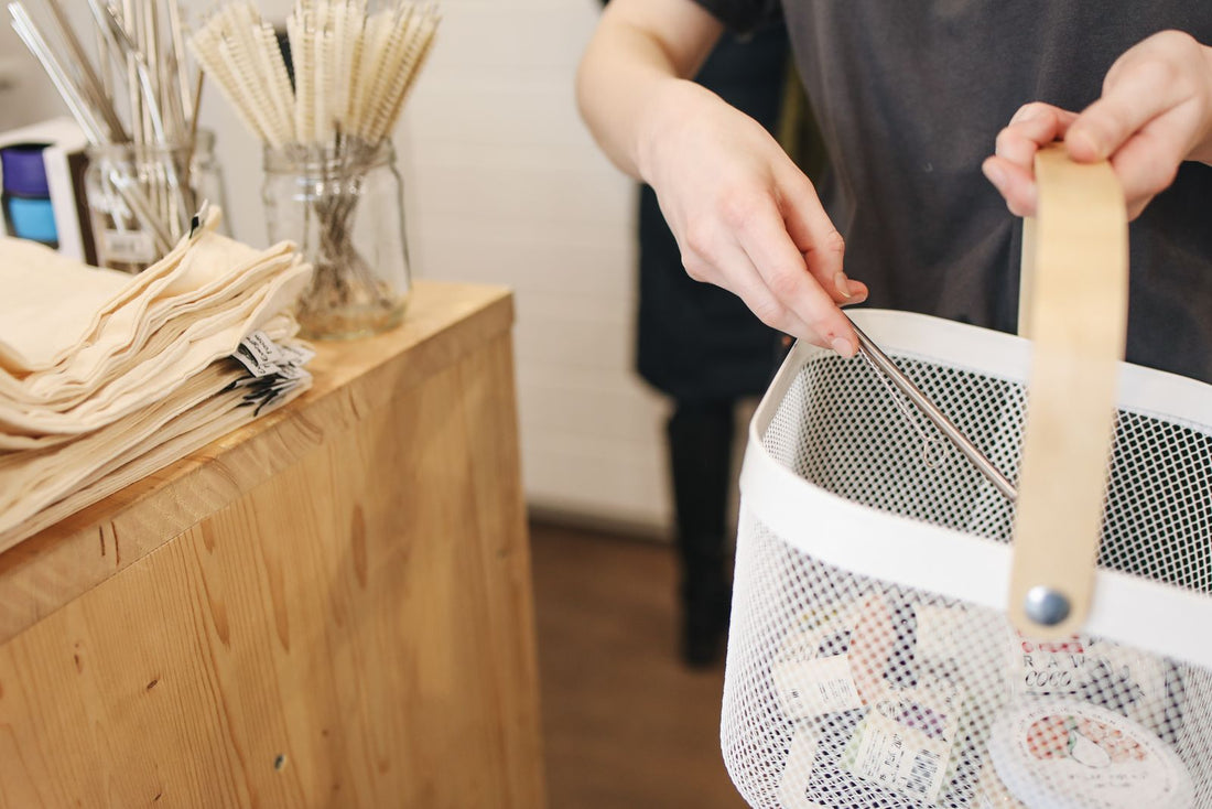 Shopper adding another item to a basket that already holds products, illustrating how to increase average order value without discounts