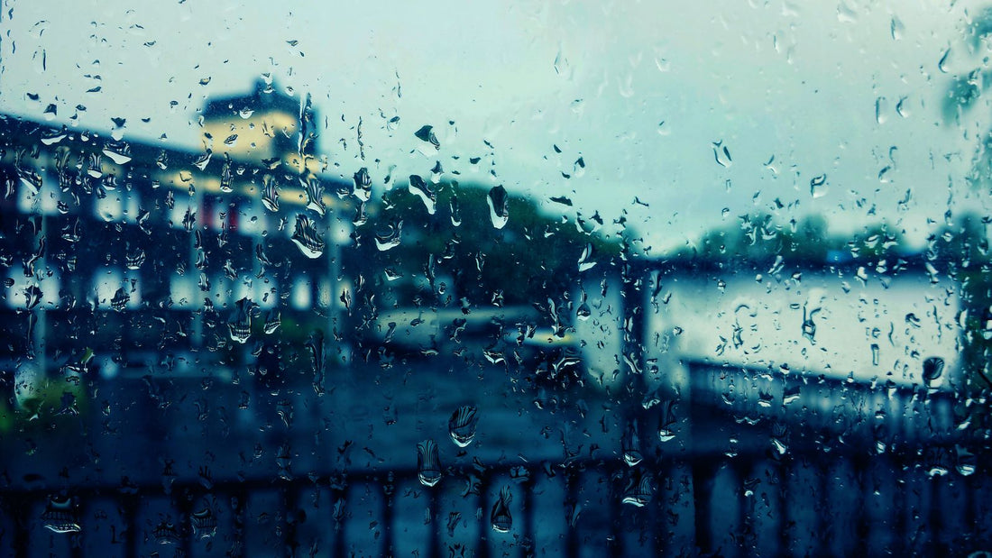 Rainy window on a gray weather day, the kind of forecast that triggers a weather triggered promotion