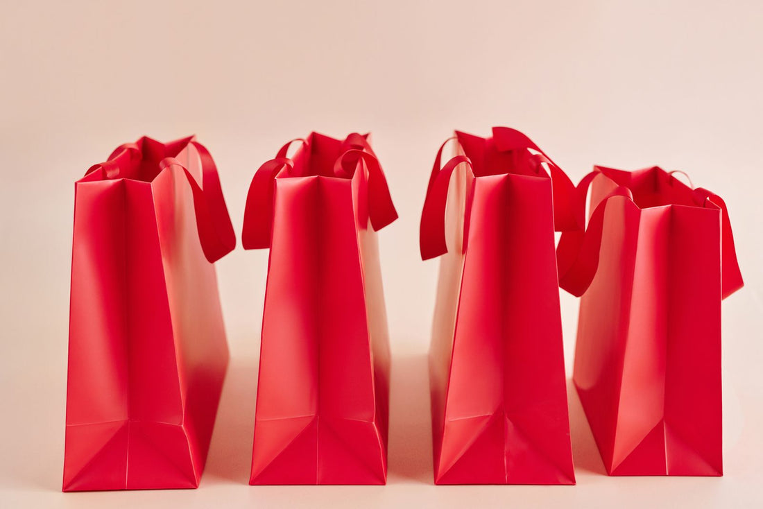 Row of red shopping bags representing Black Friday marketing ideas without discounts